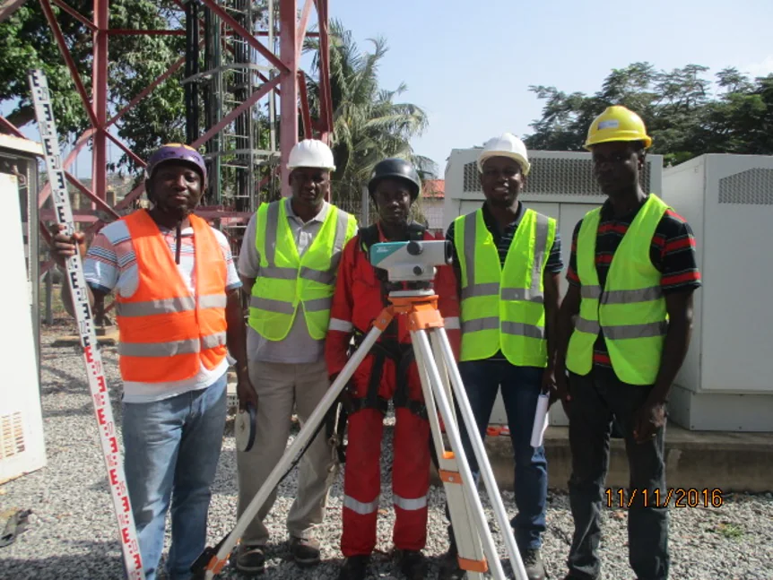 Telecommunications site inspection team carrying out tower survey and field assurance activities